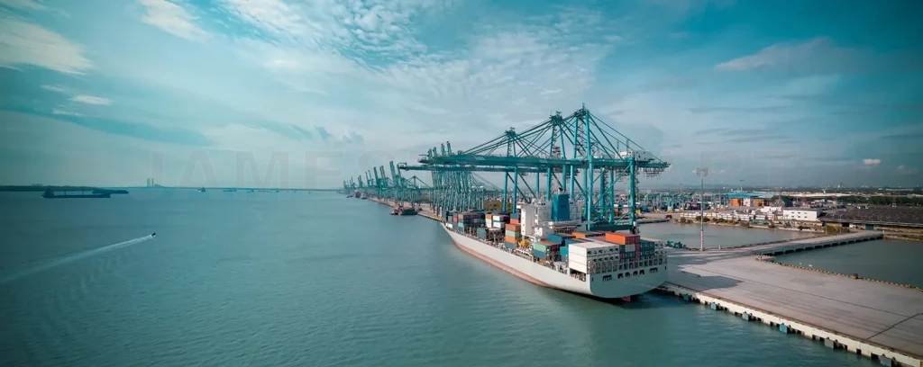 
Massive cargo ship docks at a busy international container port