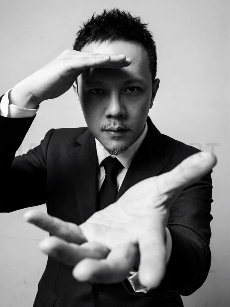 
Man in suit gazing ahead and reaching out