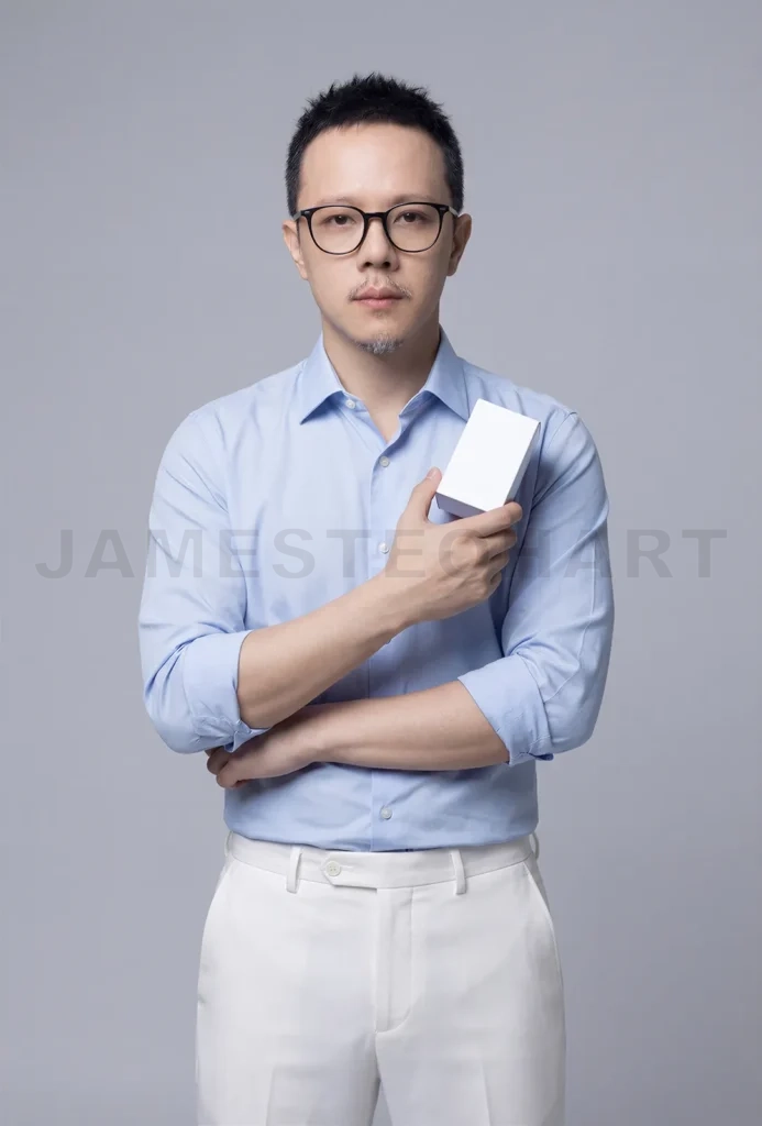 
Man holding product packaging on gray background