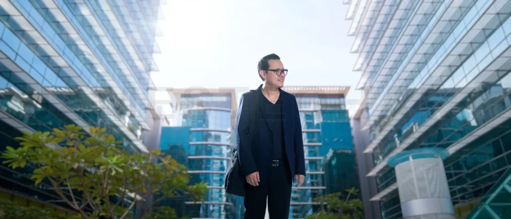 
Businessman happy walking in business center