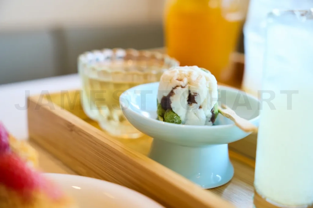 
Japanese dessert mochi matcha on a wooden tray