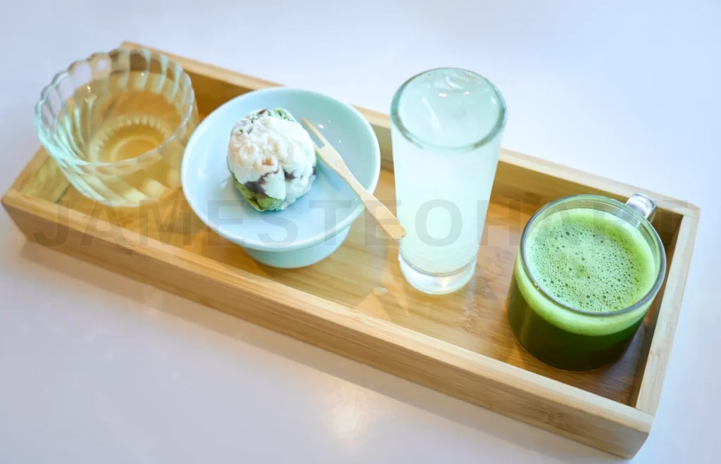 
Enjoying delicious matcha tea and japanese sweets on a wooden tray