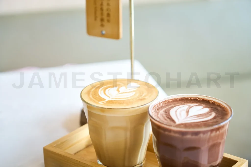 
Barista preparing latte art on coffee and chocolate drinks