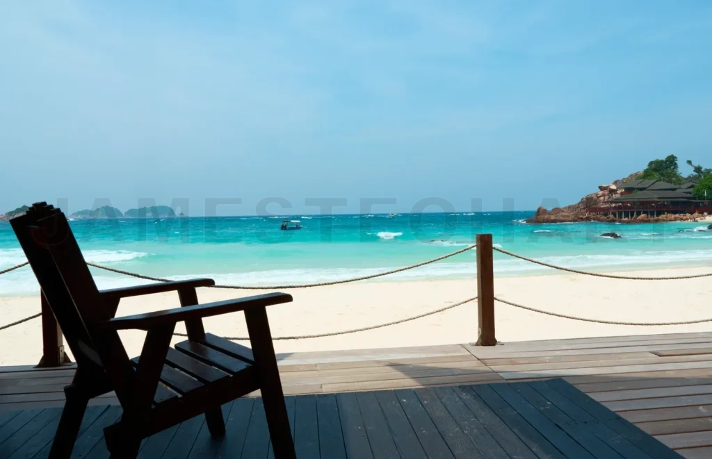 
Wooden chair standing on a terrace facing the sea in redang island