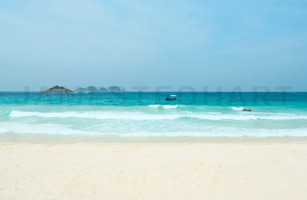 
Turquoise ocean water lapping on the white sand beach in redang island, malaysia