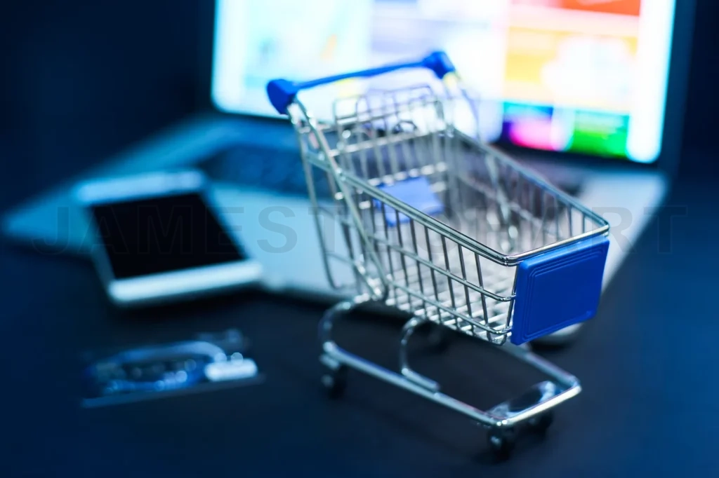 
Shopping Cart Or Trolley In Front Of Laptop , Online Marketing And Business Trading Concept