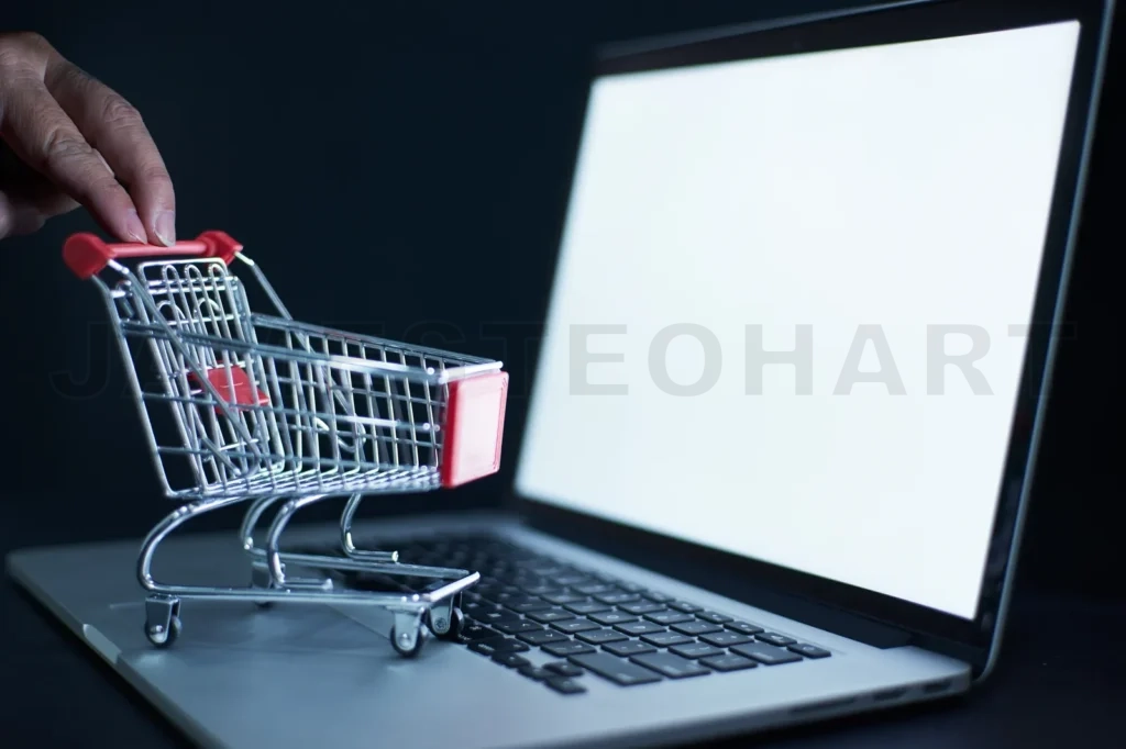 
Shopping Cart Or Trolley In Front Of Laptop , Online Marketing And Business Trading Concept