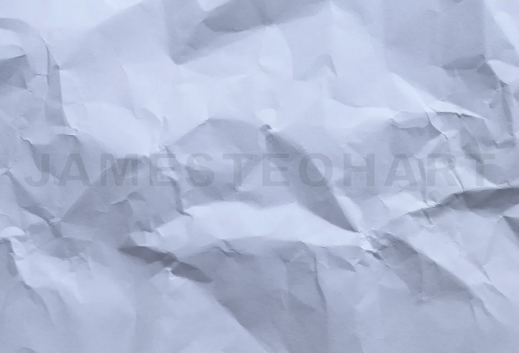 
White crumpled paper forming an uneven textured background