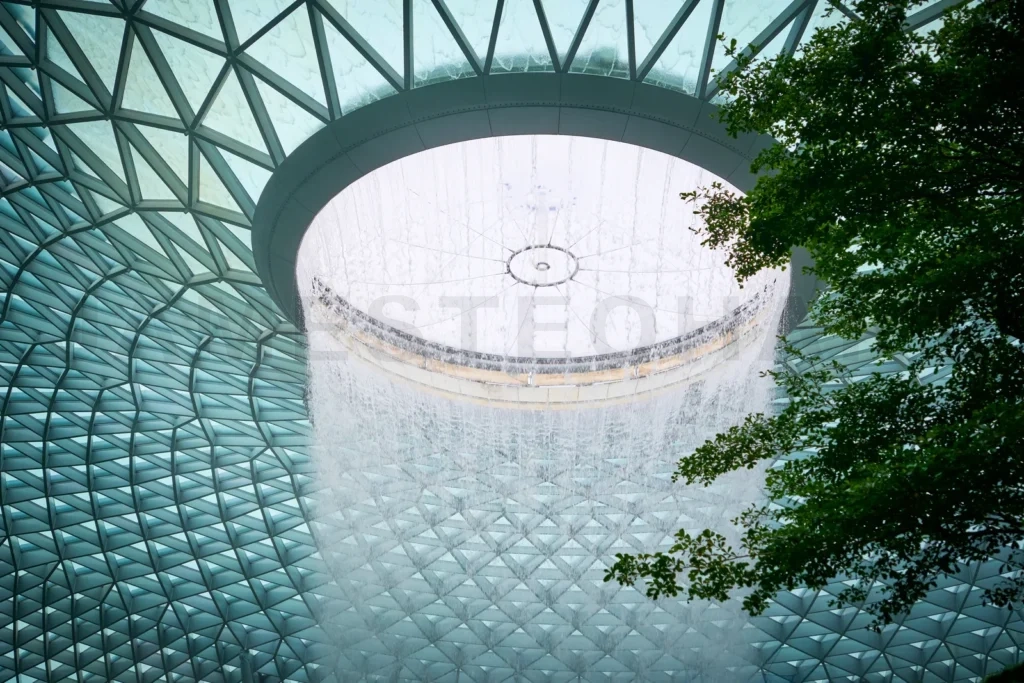 
Circular waterfall cascading inside jewel changi airport, singapore