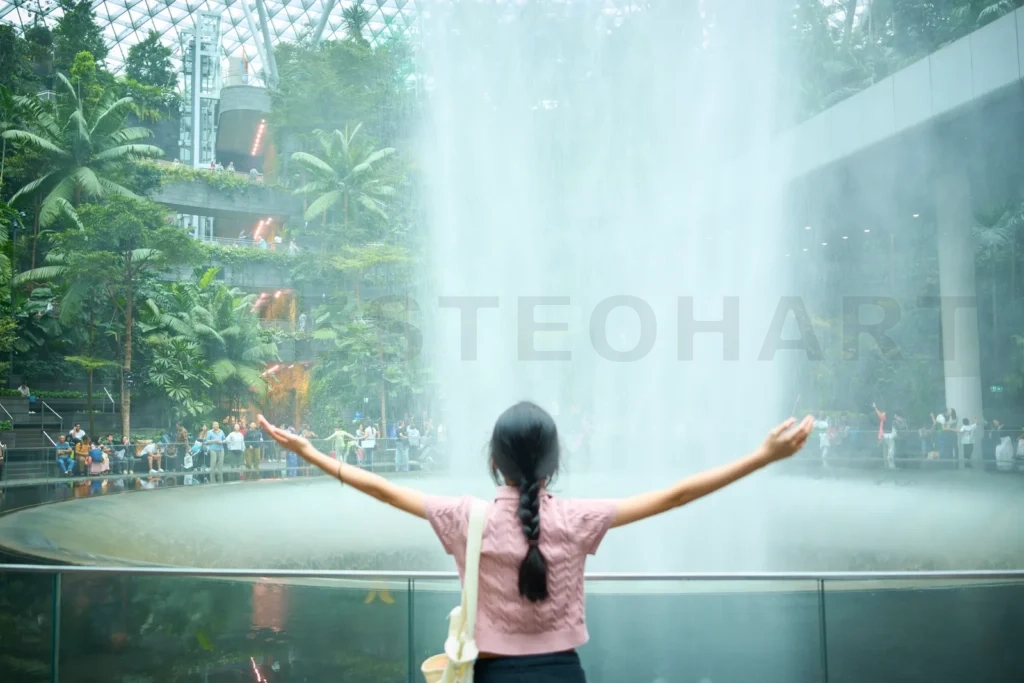 
Tourist enjoying the rain vortex at jewel changi airport, singapore