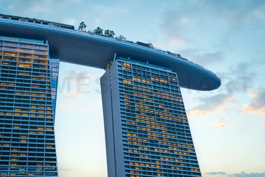 
Marina bay sands hotel dominating singapore skyline at dusk