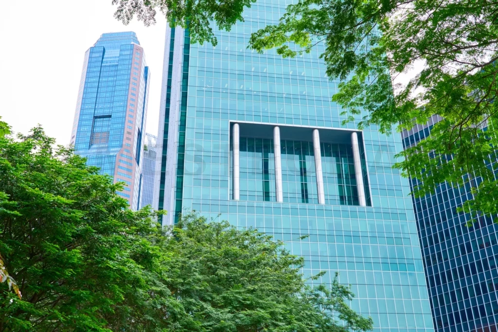 
Green foliage framing modern skyscrapers in singapore’s bustling cbd