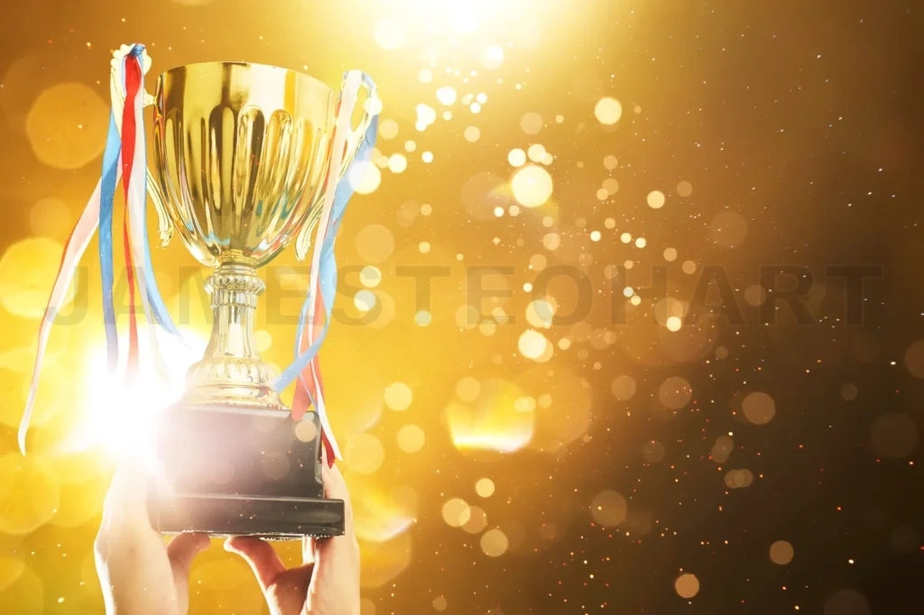 
Hand Raised, Holding Gold Cup With Abstract Shiny Lights