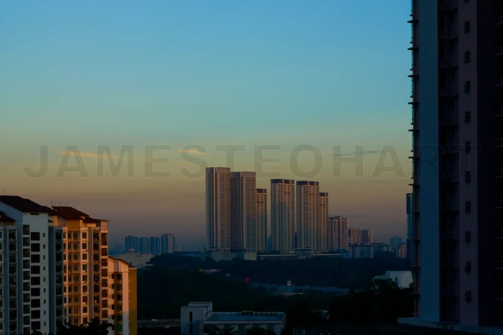 
Modern cityscape emerging during colorful sunrise in residential area