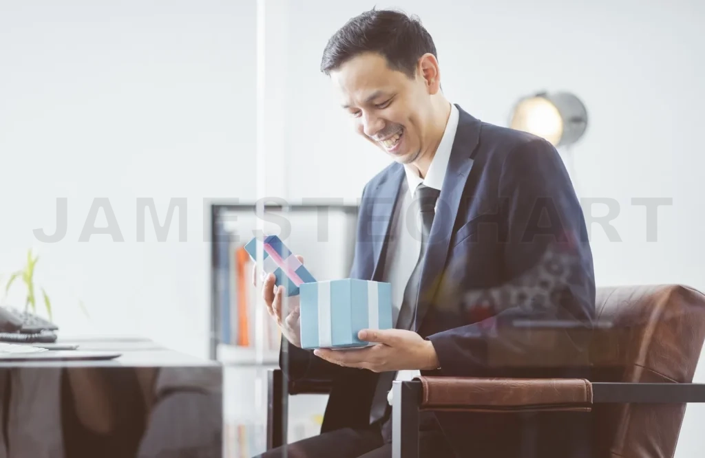 
Asian Businessman Happy Smile Open Christmas Gift Box From Client In Office