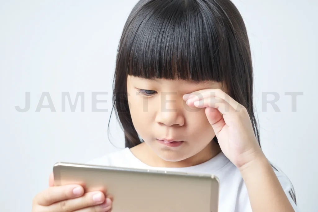 
Little Asian Chinese Girl Using Smartphone Long Time And Eye Feel Tired
