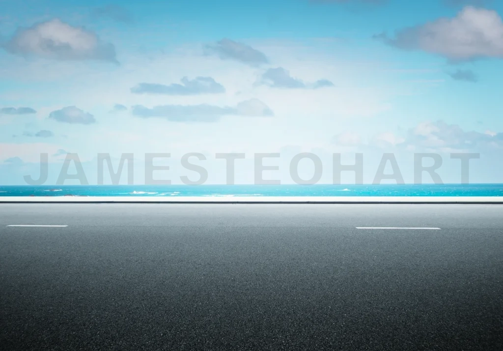 
Side View Asphalt Road On Sunny Summer Day Near The Sea