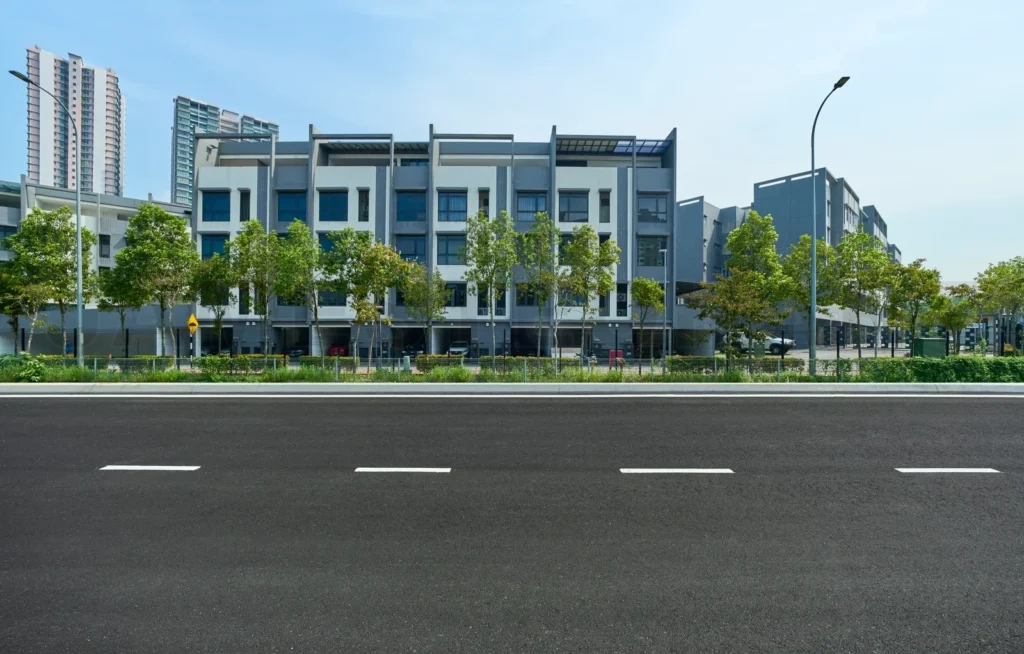 
Modern townhouses along urban street with empty road
