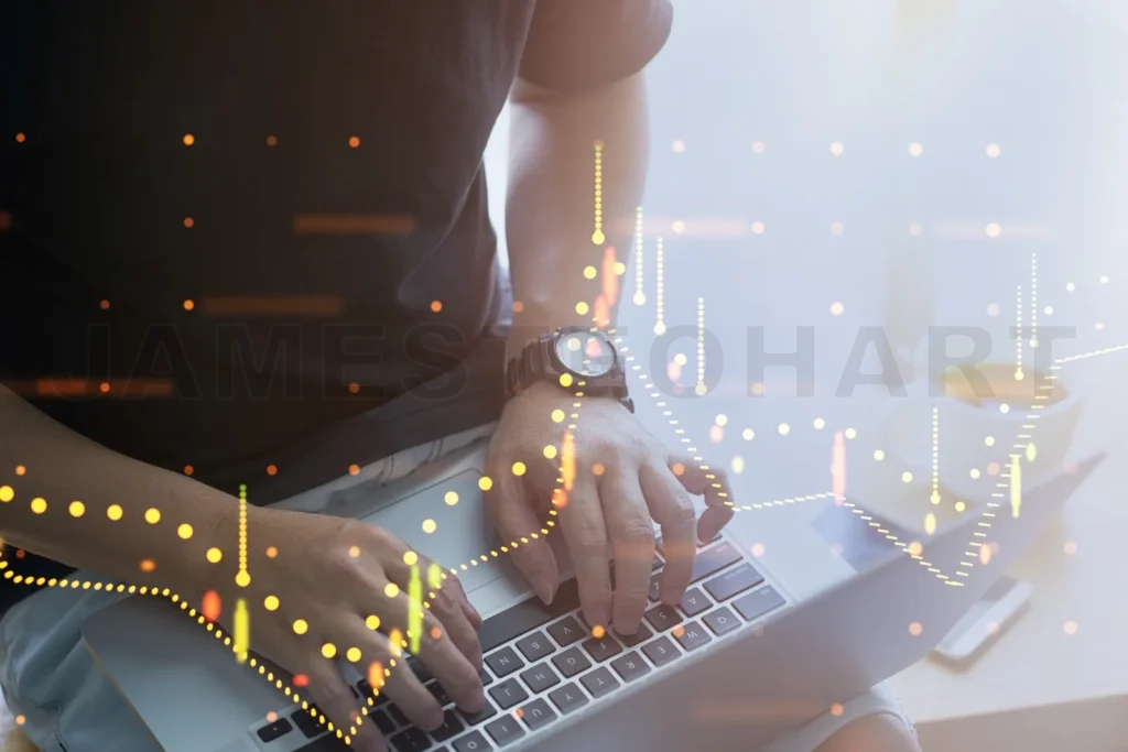 
Businessman working on laptop with stock market graph showing growth