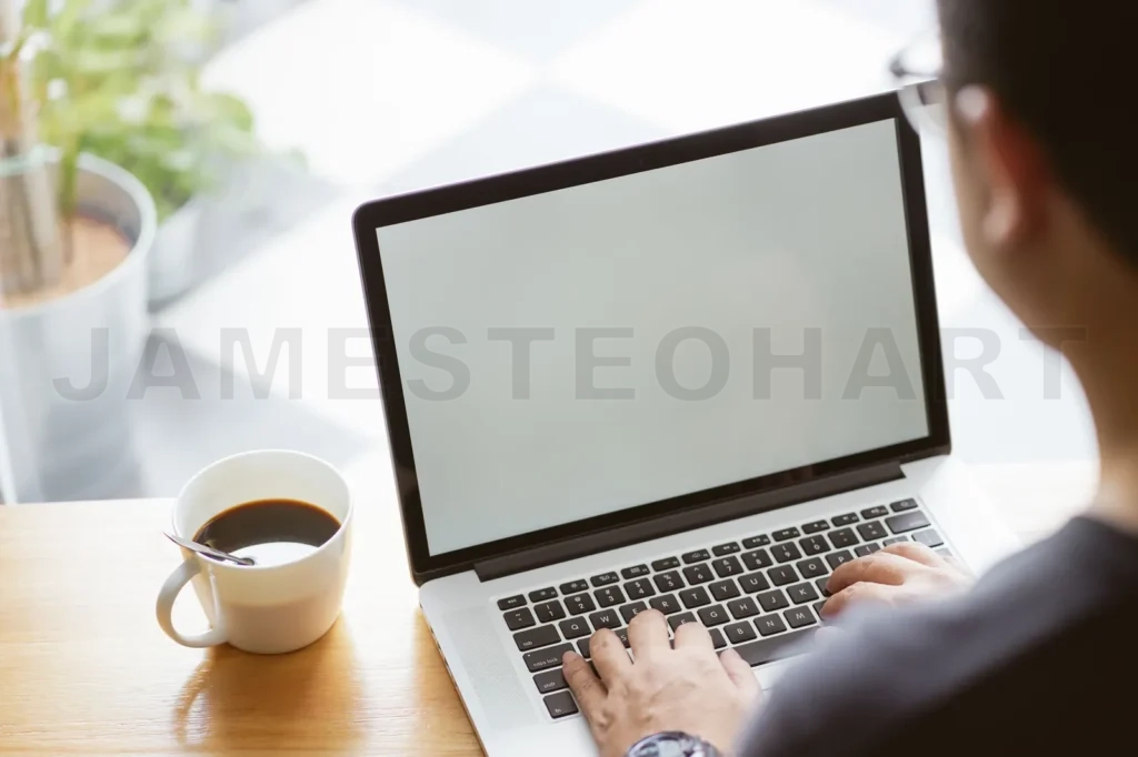
Laptop In Businessman Hand With Coffee
