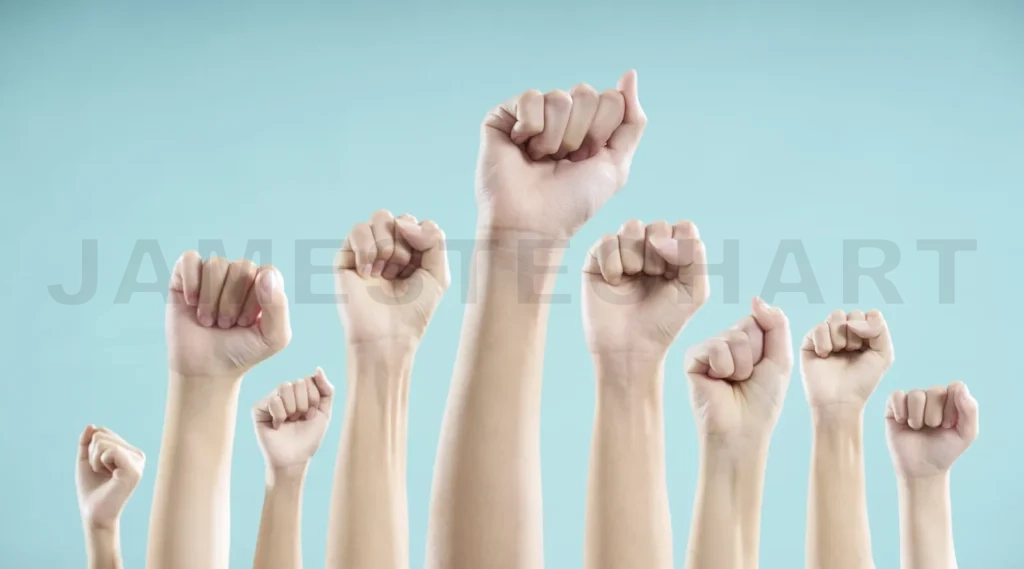
People raising clenched fists in protest and unity