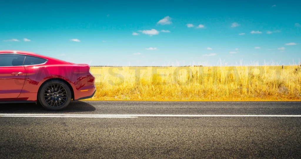 
Sport Car
Parked On Road Side With Field Of Golden Wheat Background