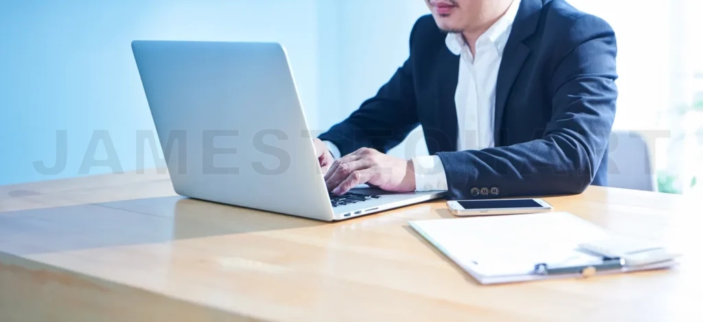 
Close up view of businessman using laptop