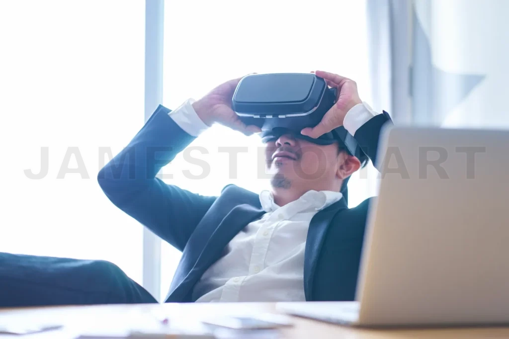 
Young Businessman Sitting At Office Take A Break To Enjoy Wearing Virtual Reality Goggle See The Movie