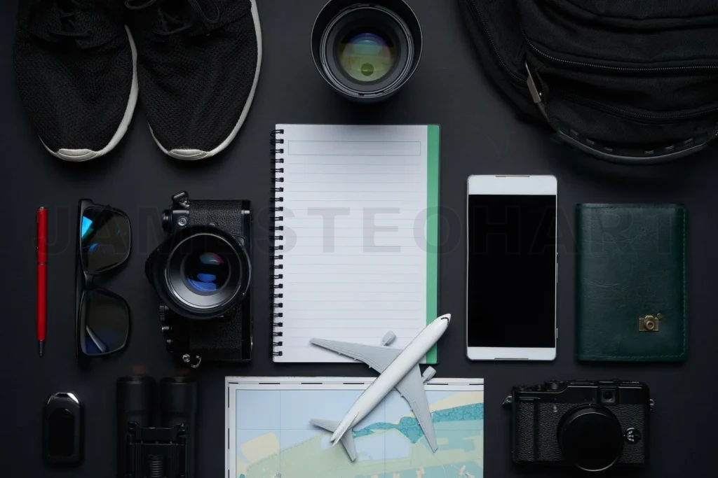 
Travel planning with essential items and electronics flat lay