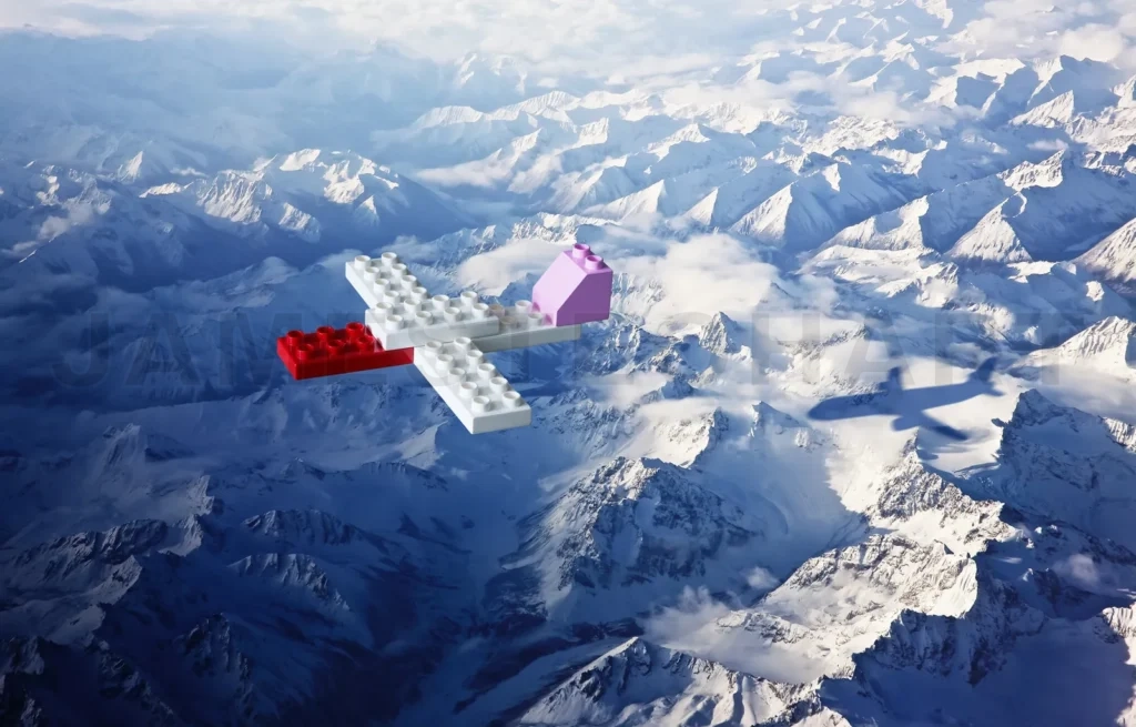 
Plastic Building Blocks With Aeroplane Shadow , Top Angle View Ice Mountain Landscape