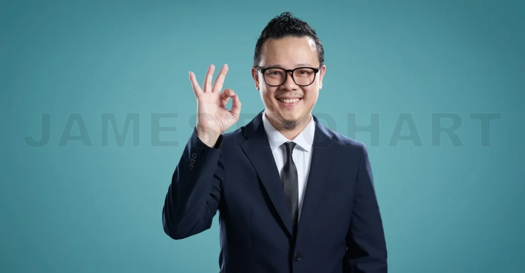 
Confident businessman giving ok sign