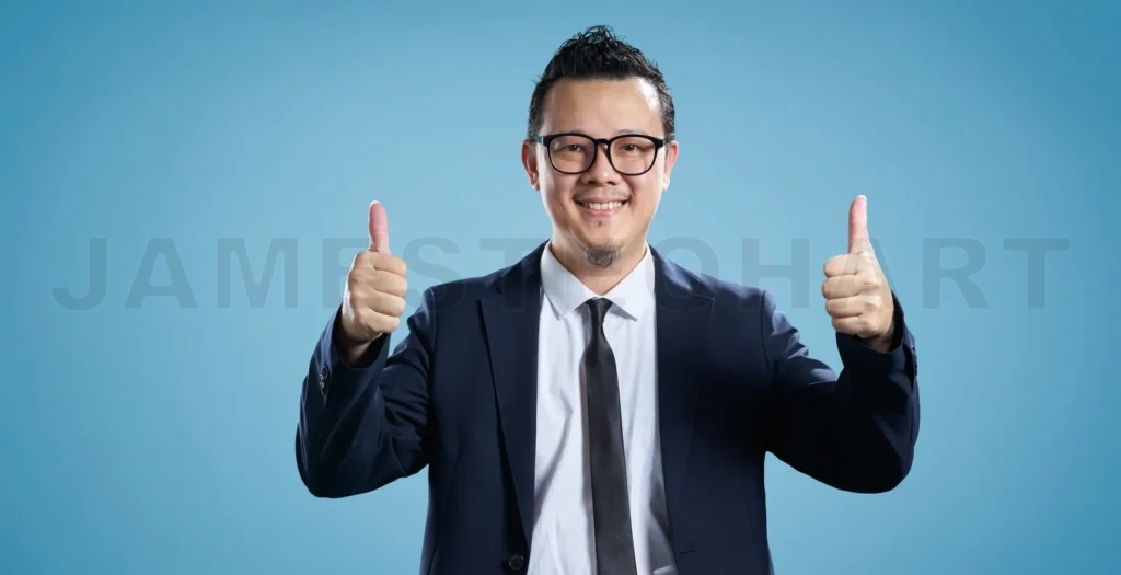 
Confident businessman giving double thumbs up