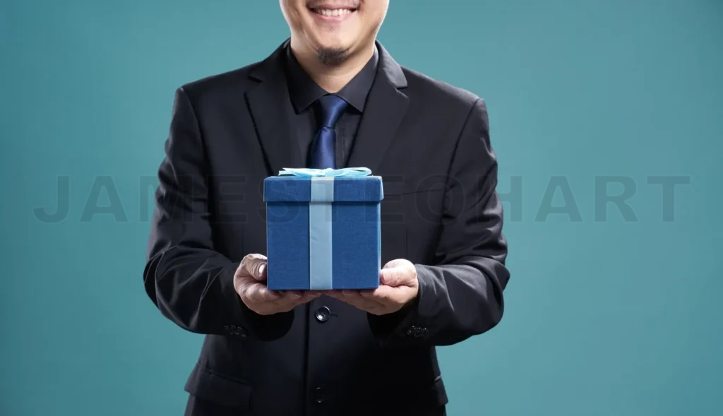 
Close Up Of Man With Blue Present Box , Isolated On Light Blue Background