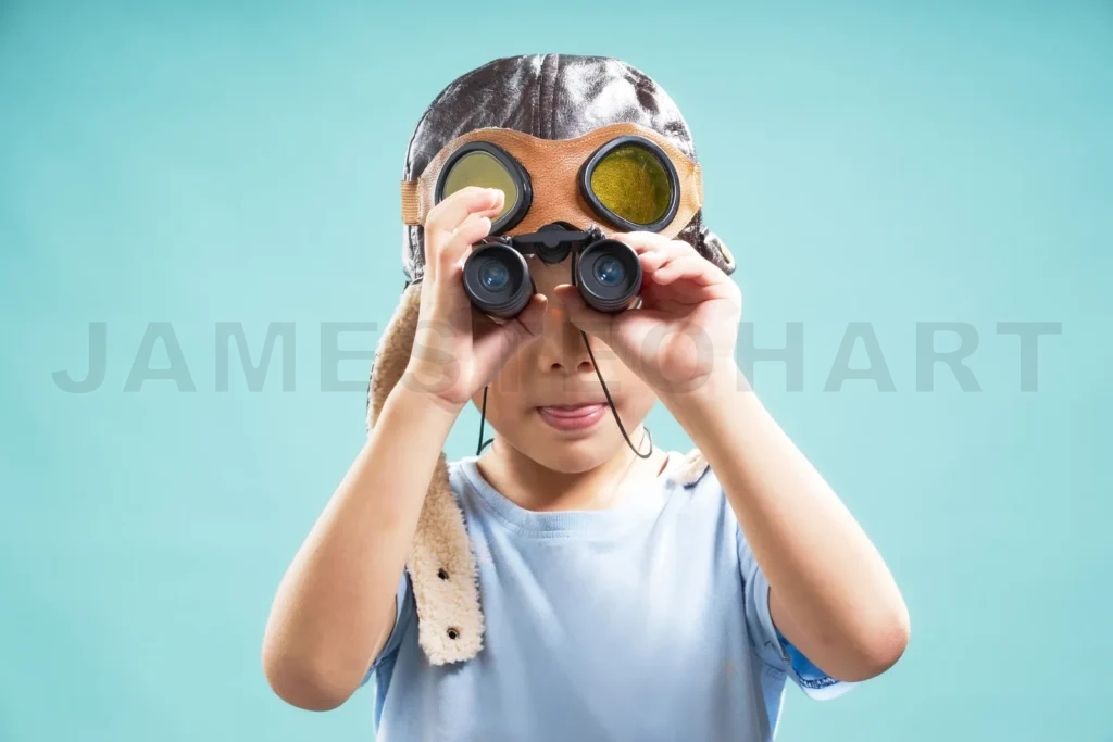 
Little Young Cute Asian Boy Using Telescope Looking Forward