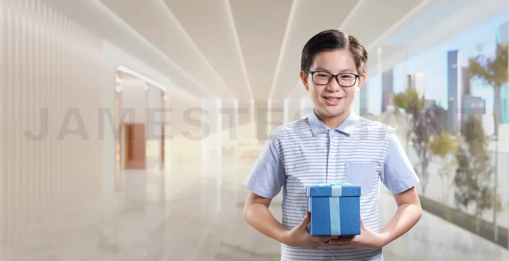 
Smiling boy holding gift box in modern shopping mall