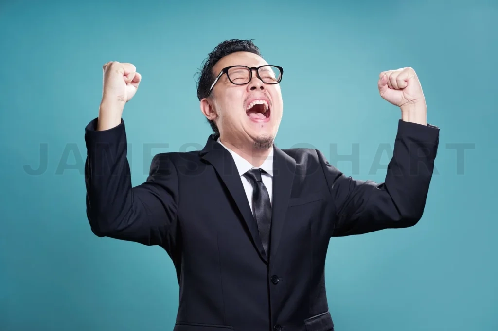 
Excited Businessman Isolated On The Cyan Background