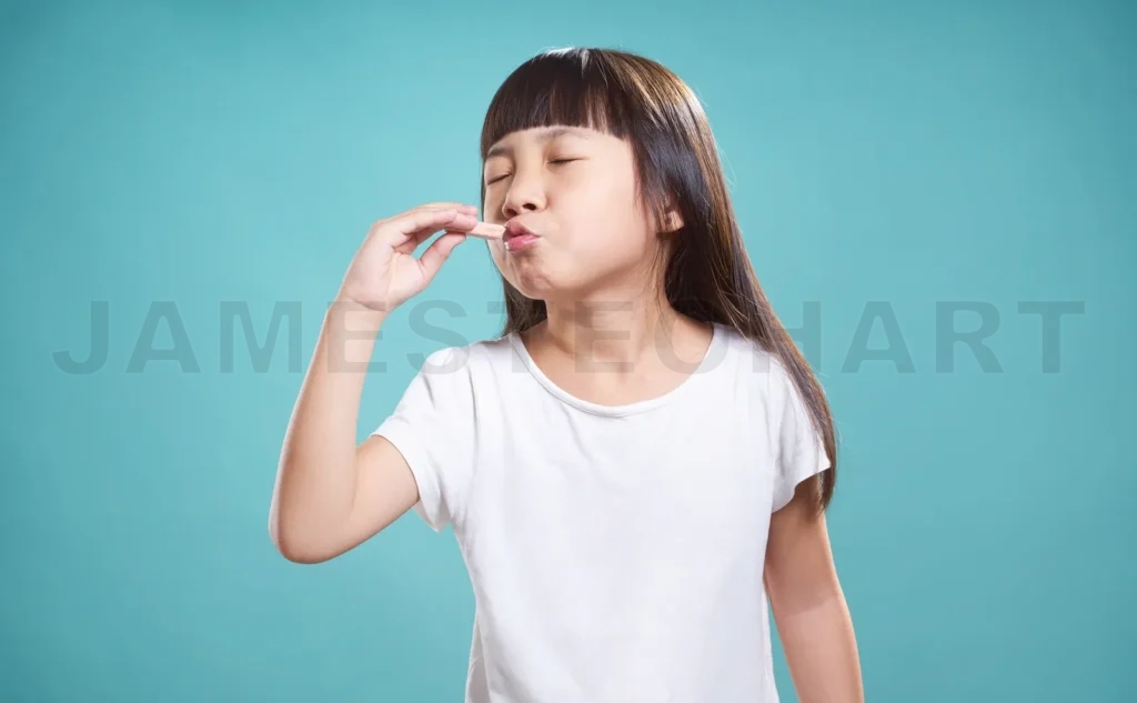 
Close Up Portrait Of Asian Little Happy Girl With Good Taste Chocolate