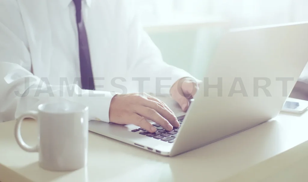 
Businessman Hands Working On Laptop,Blurred Background