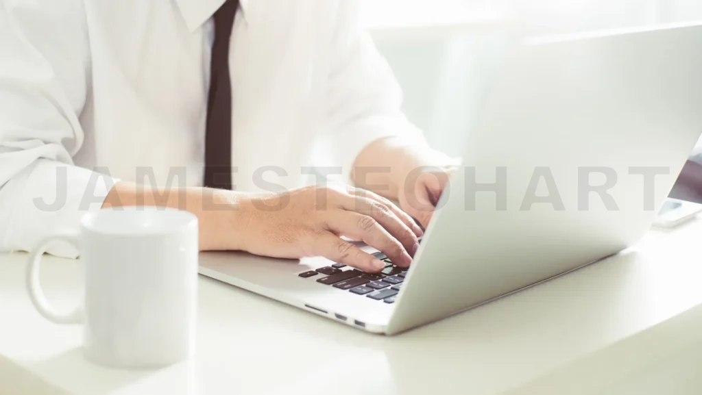 
Businessman Hands Working On Laptop,Blurred Background