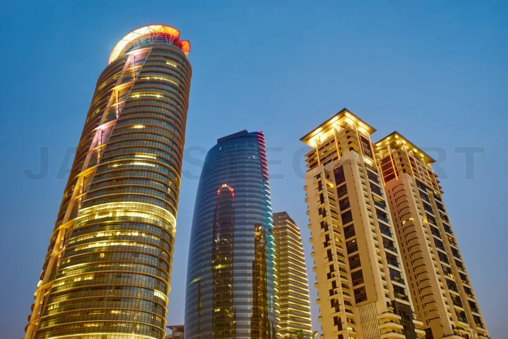 
Modern skyscrapers illuminated at twilight