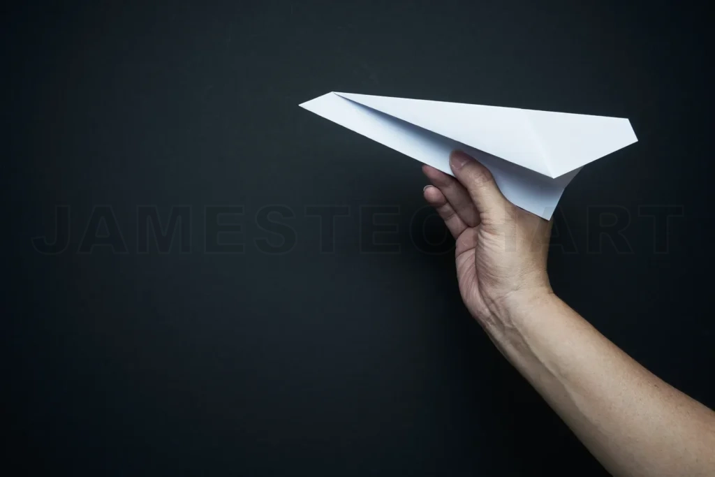 
Hand launching paper plane representing new ideas