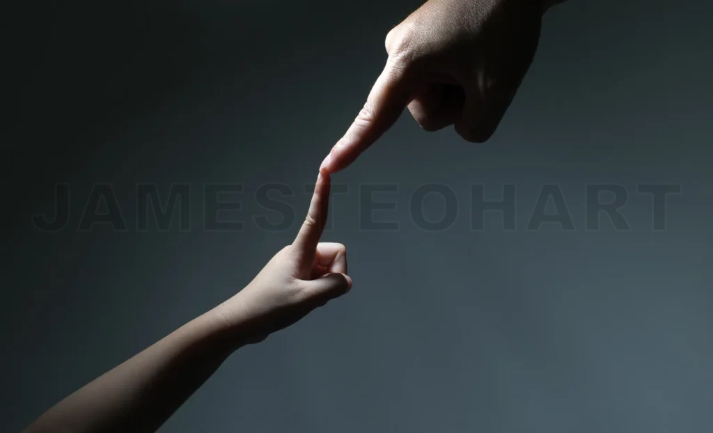 
Two Hands, Father And Kid, Touch Each Other As Symbol Of Family Love And Trust On Black Background