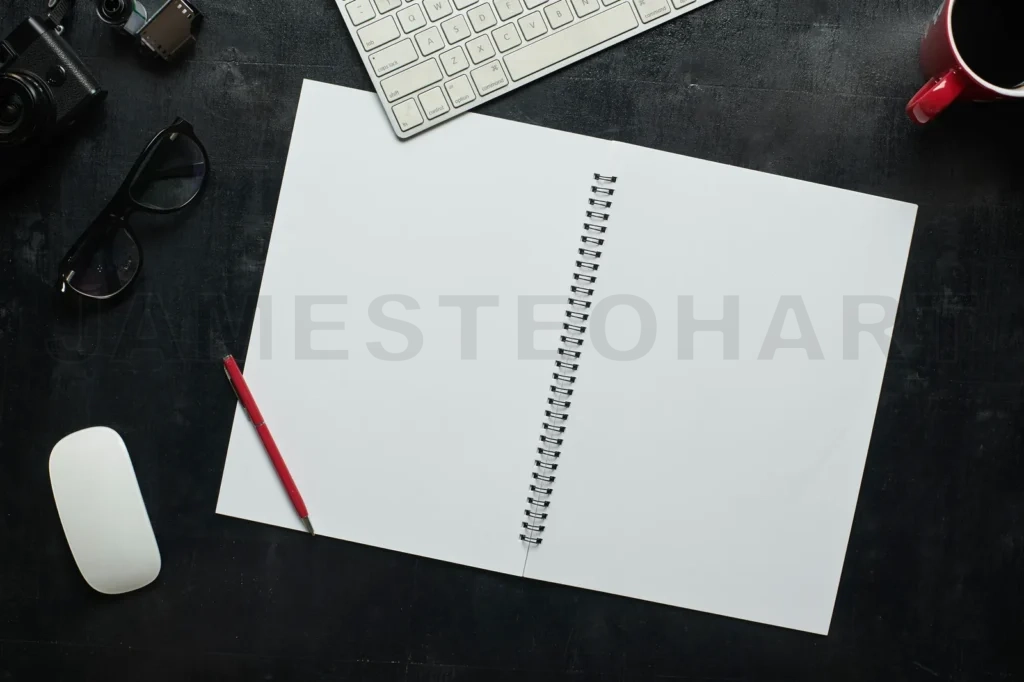 
Wooden Black Office Desk Table With Notebook, Camera And Other Supplies With Cup Of Coffee
