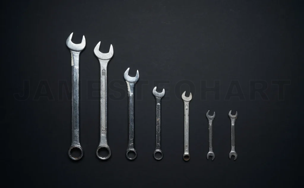 
Wrenches set from large to small on black background
