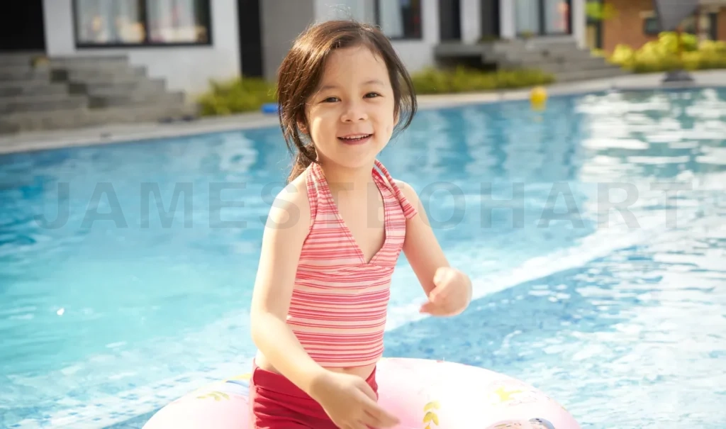 
Cheerful child with float in pool