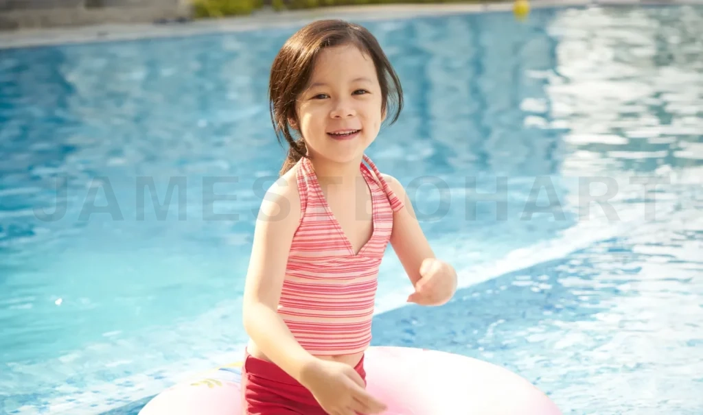 
Cheerful child with float in pool
