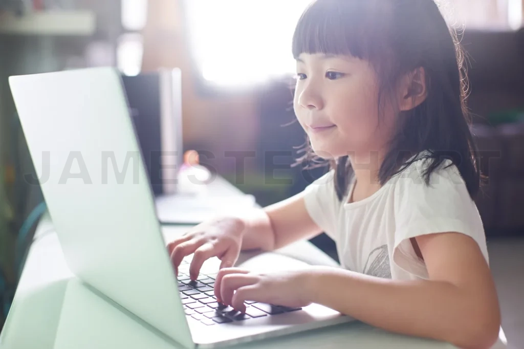 
Little Asian Girl  Using Laptop To Studying