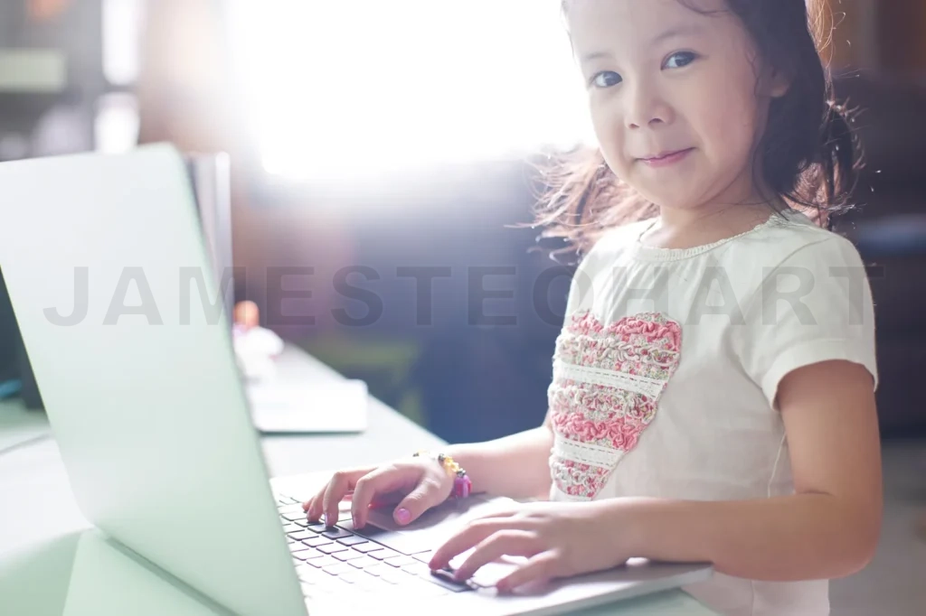 
Little Asian Girl Enjoy Using Laptop To Studying