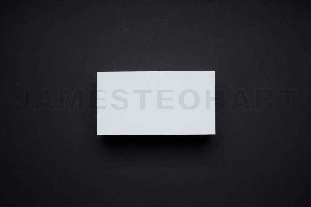 
Blank white business card on dark background