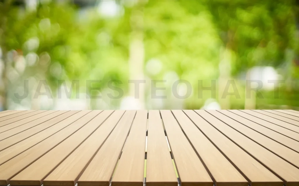 
Empty Wooden Table With Out Of Focus Green Park Background